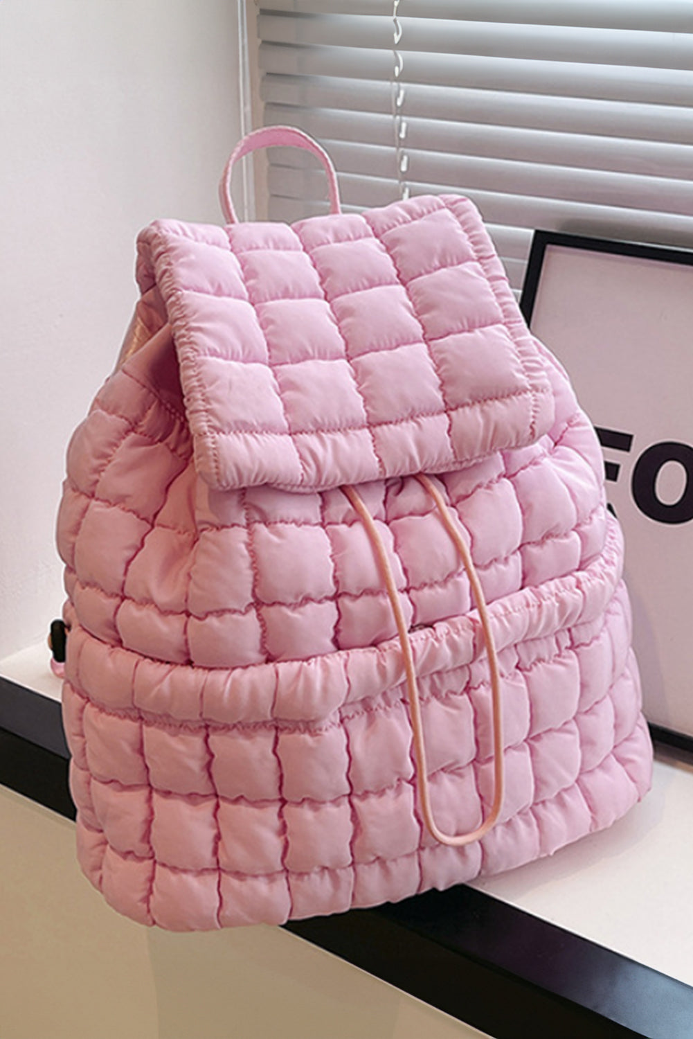 Black Solid Flapped Quilted Puffer Backpack