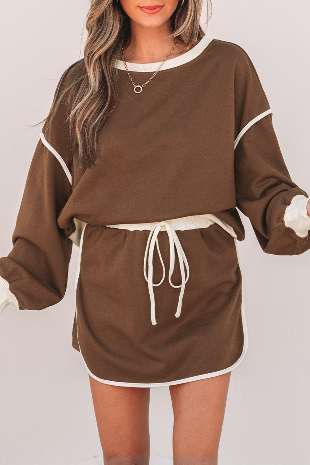 Evergreen Color Contrast Loose Pullover and Lace-up Waist Skort Set